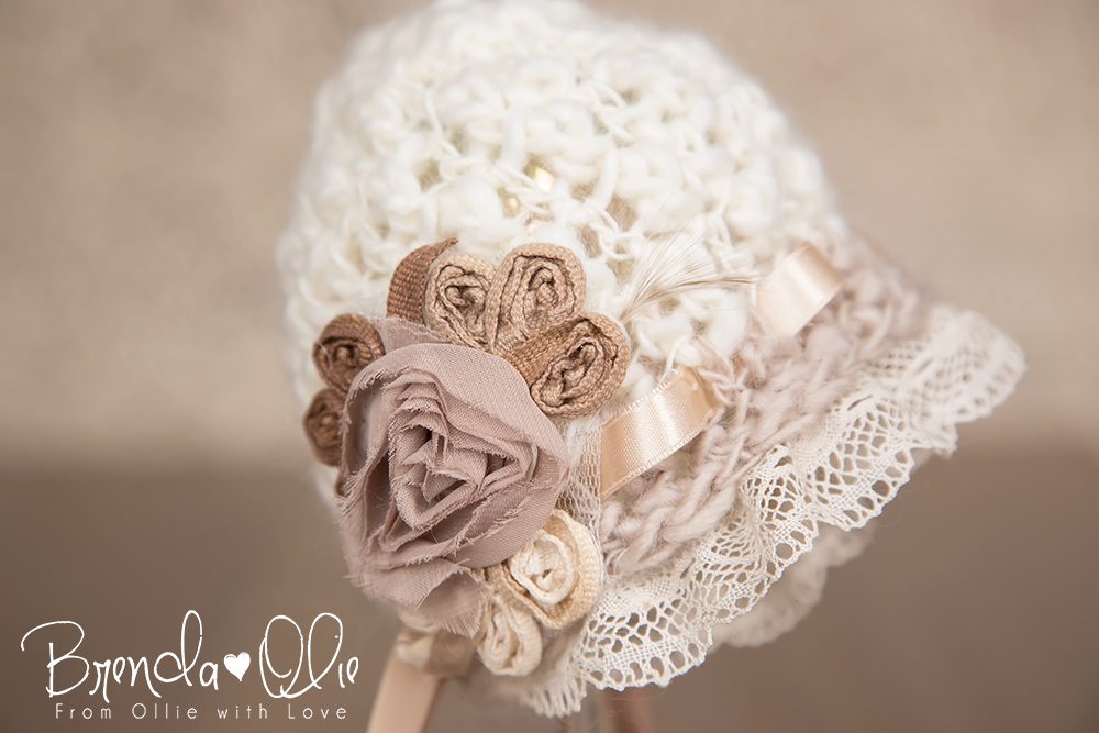 A knitted newborn bonnet from Lovable Photography Props